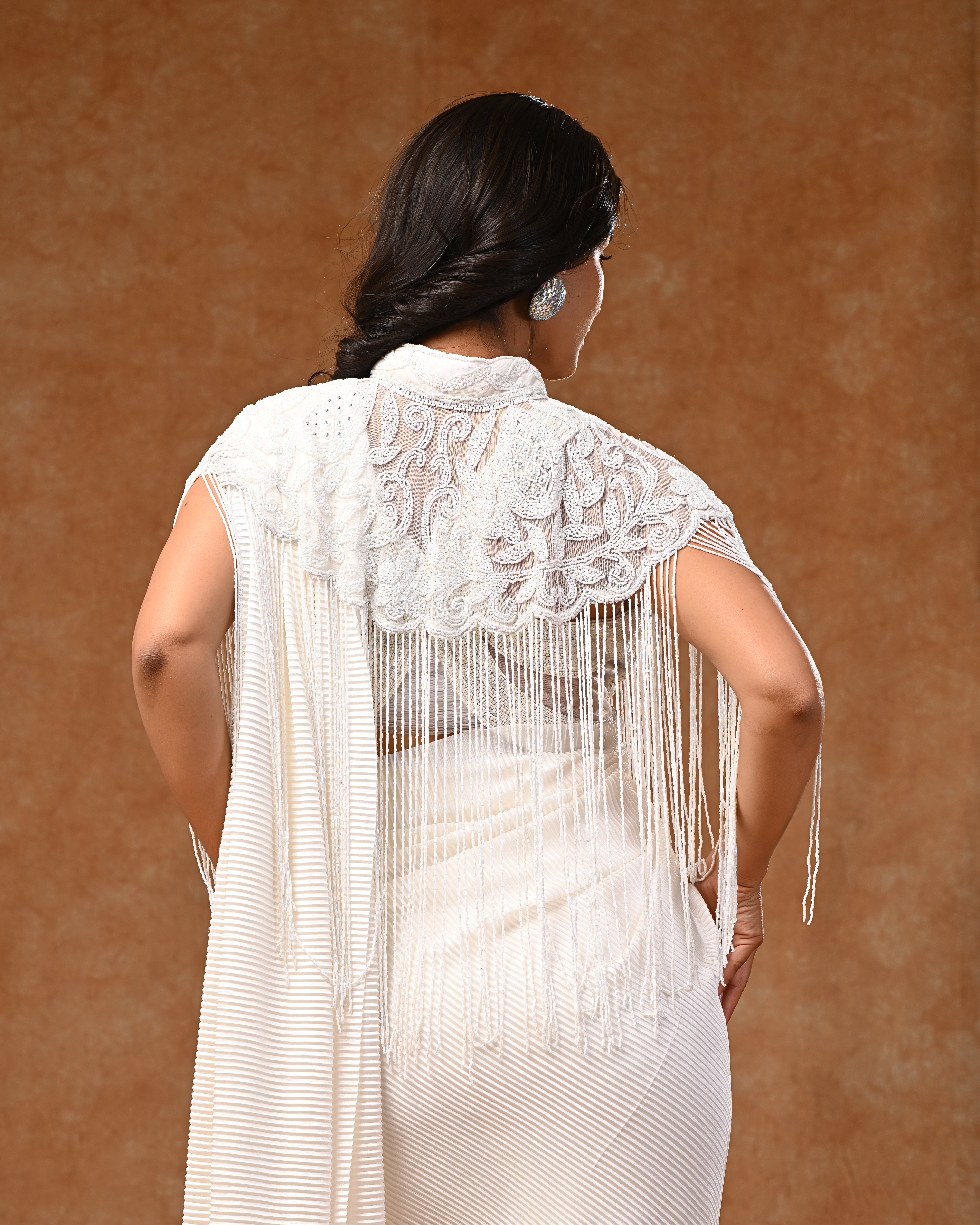 White embellished cape