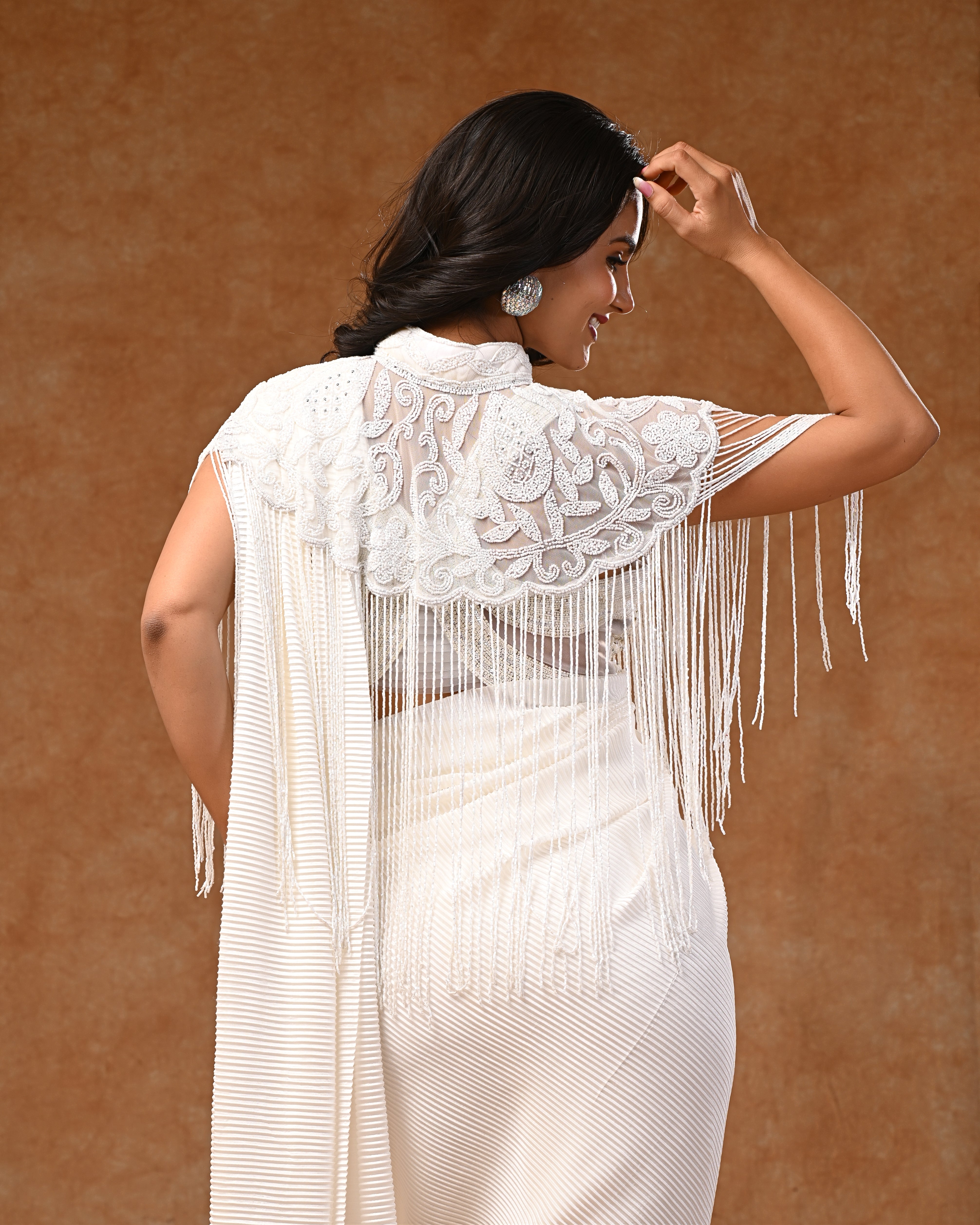 White embellished cape