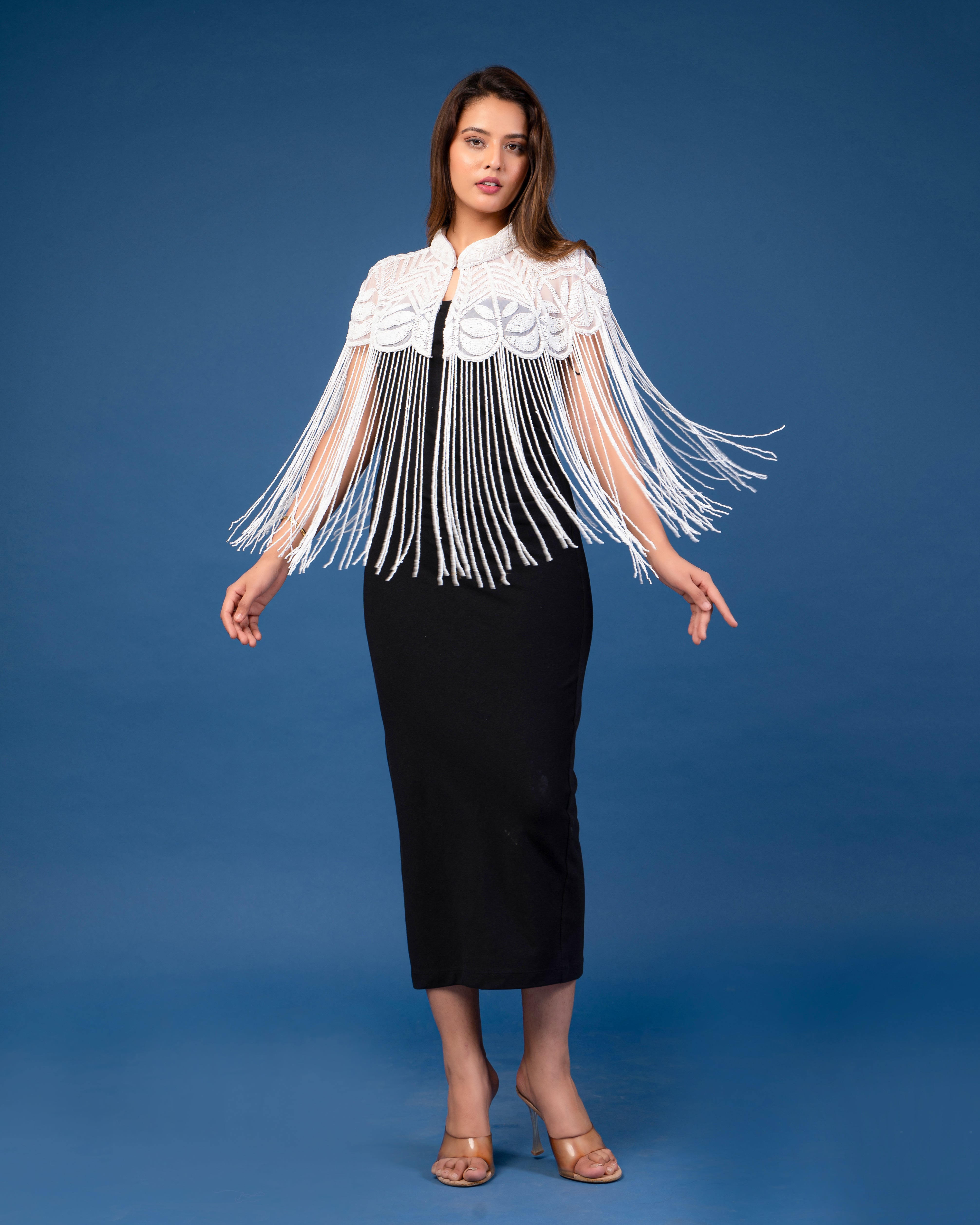 White on white embellished cape