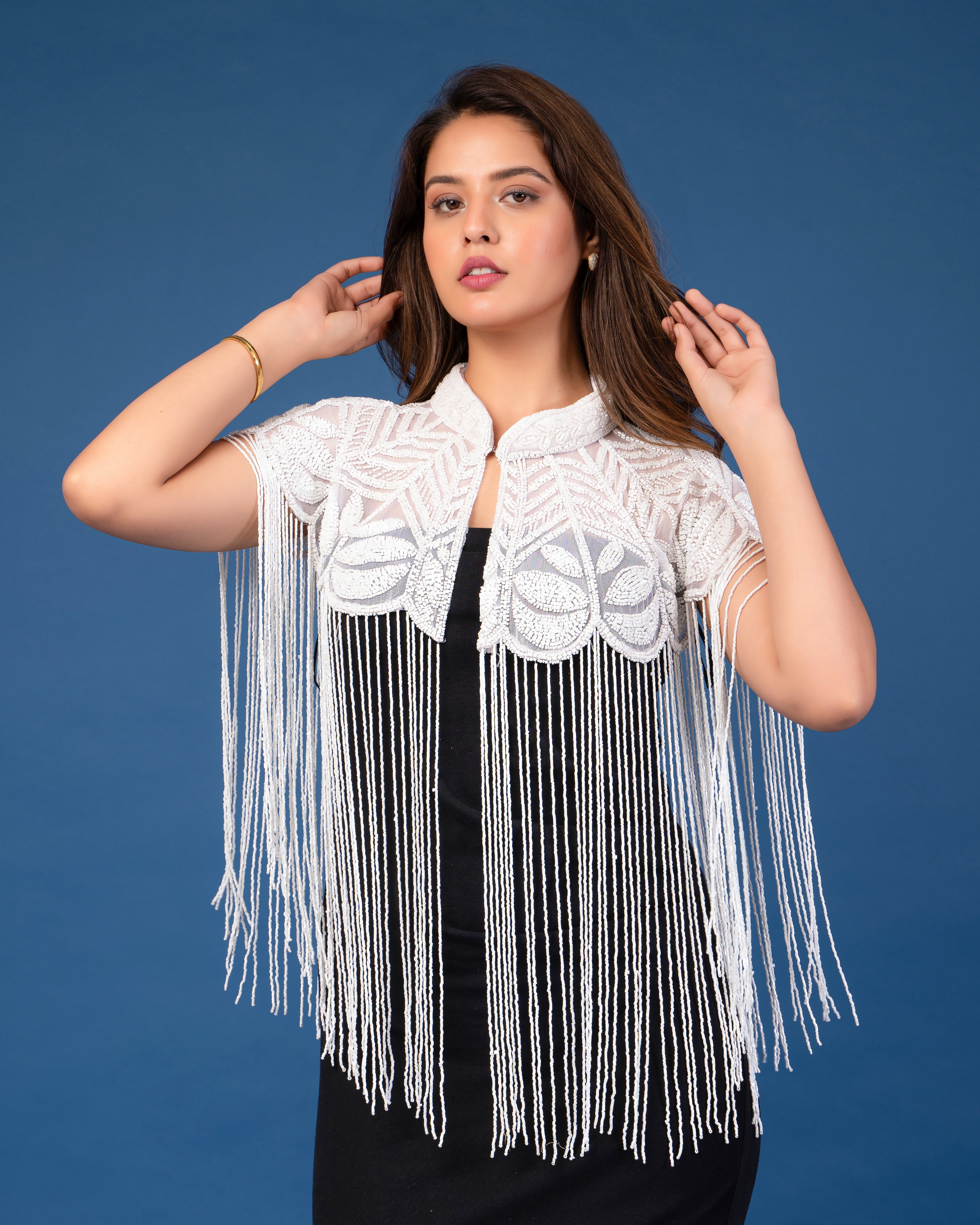 White on white embellished cape