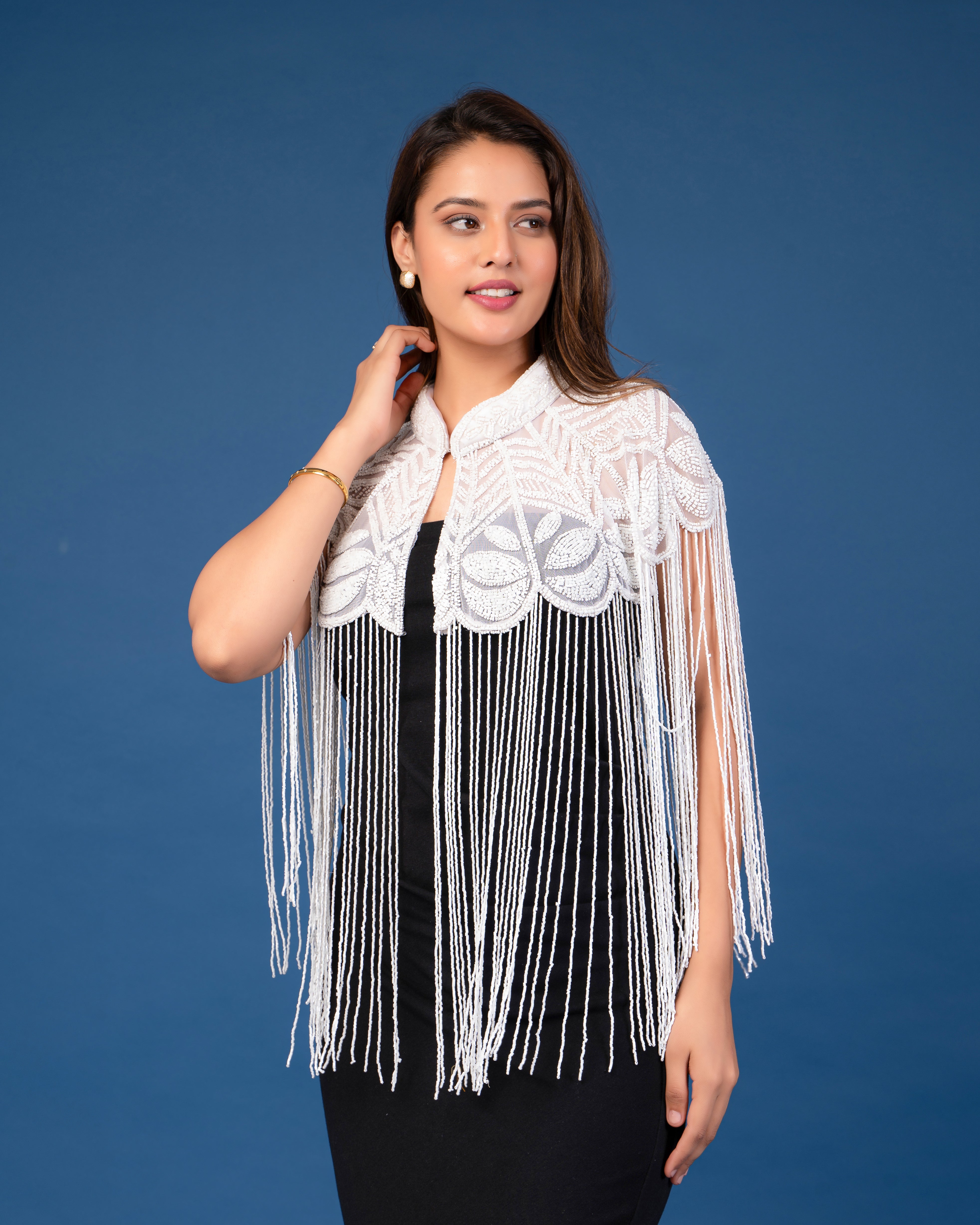 White on white embellished cape