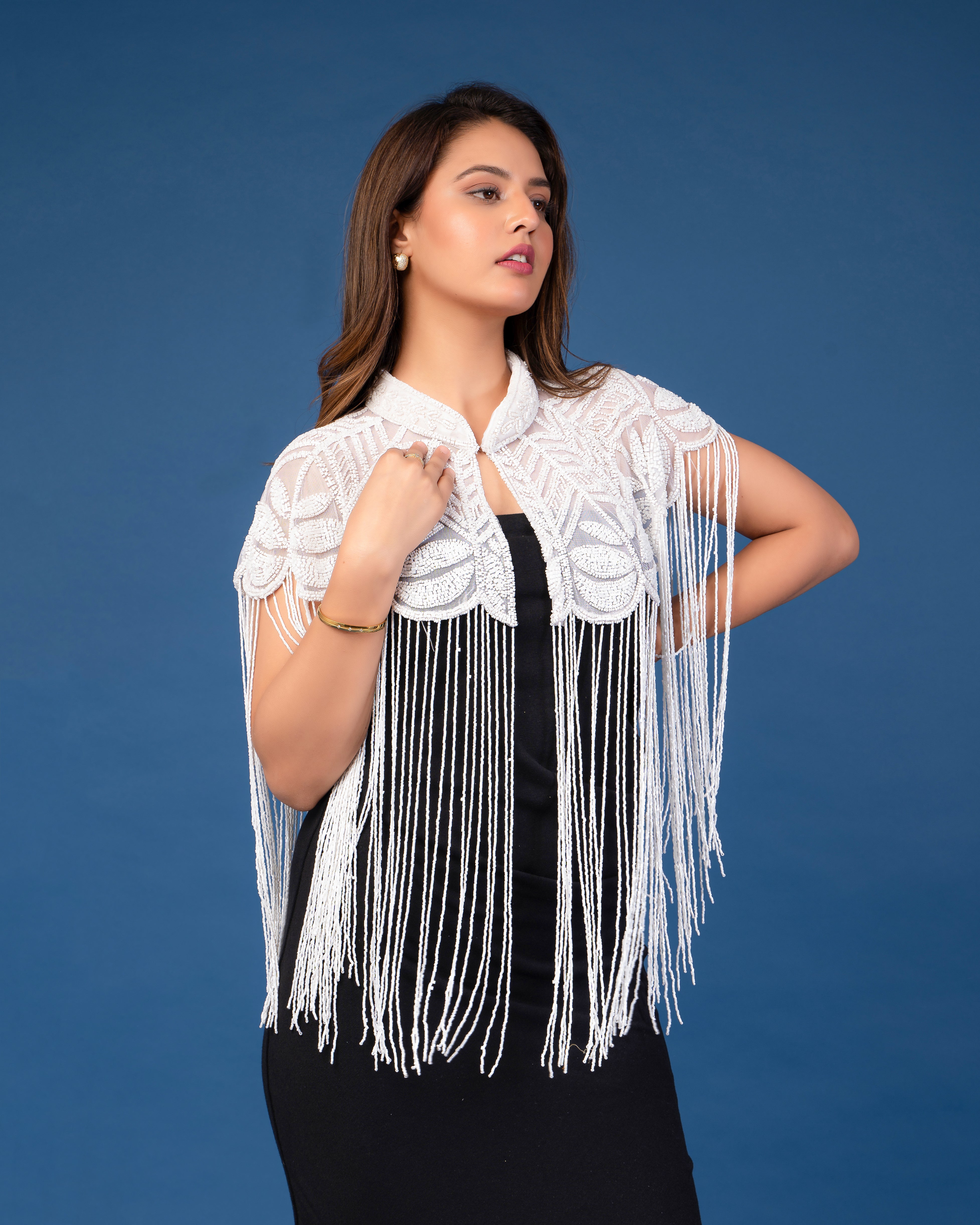 White on white embellished cape