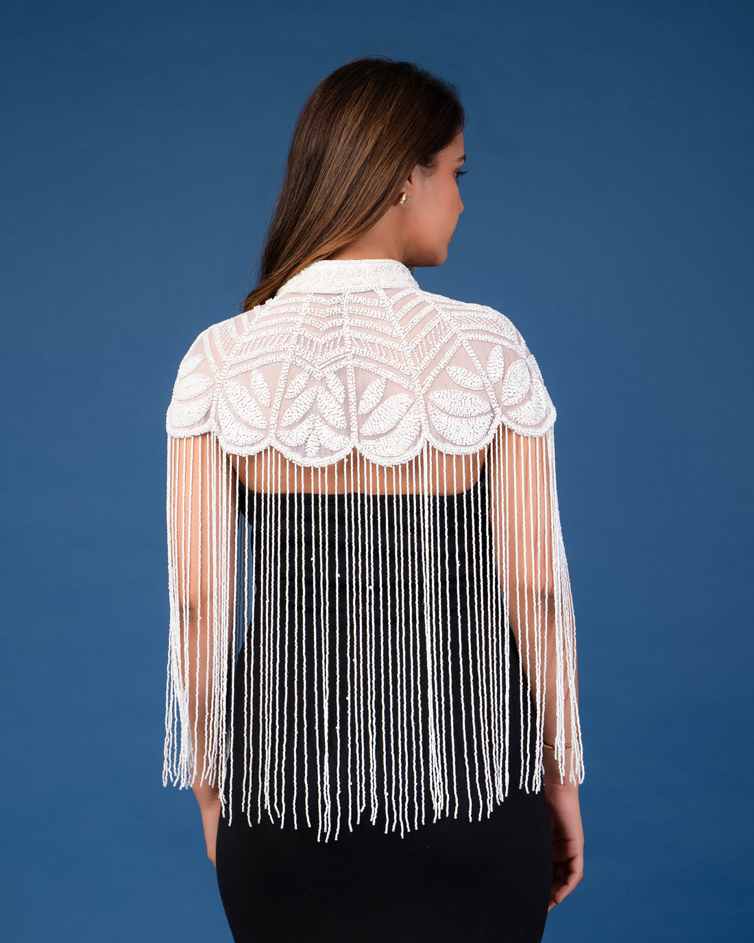 White on white embellished cape