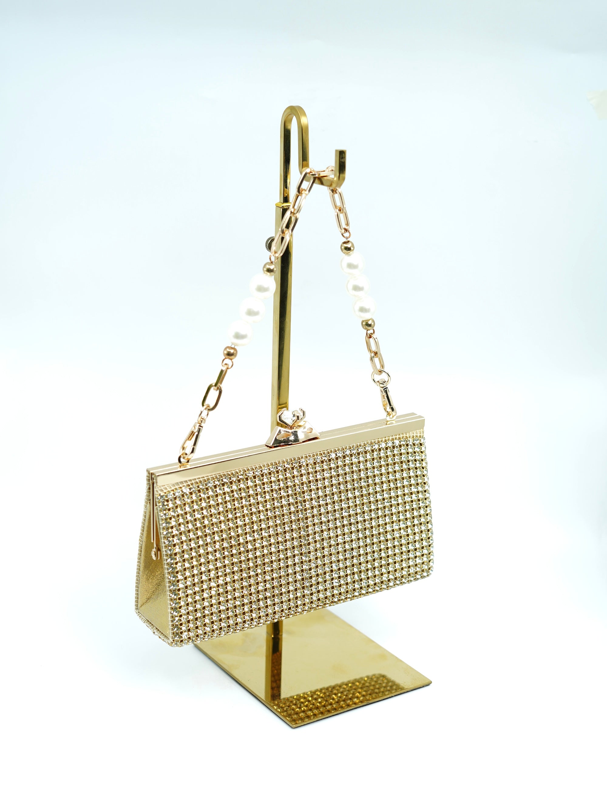 The golden rhinestone clutch