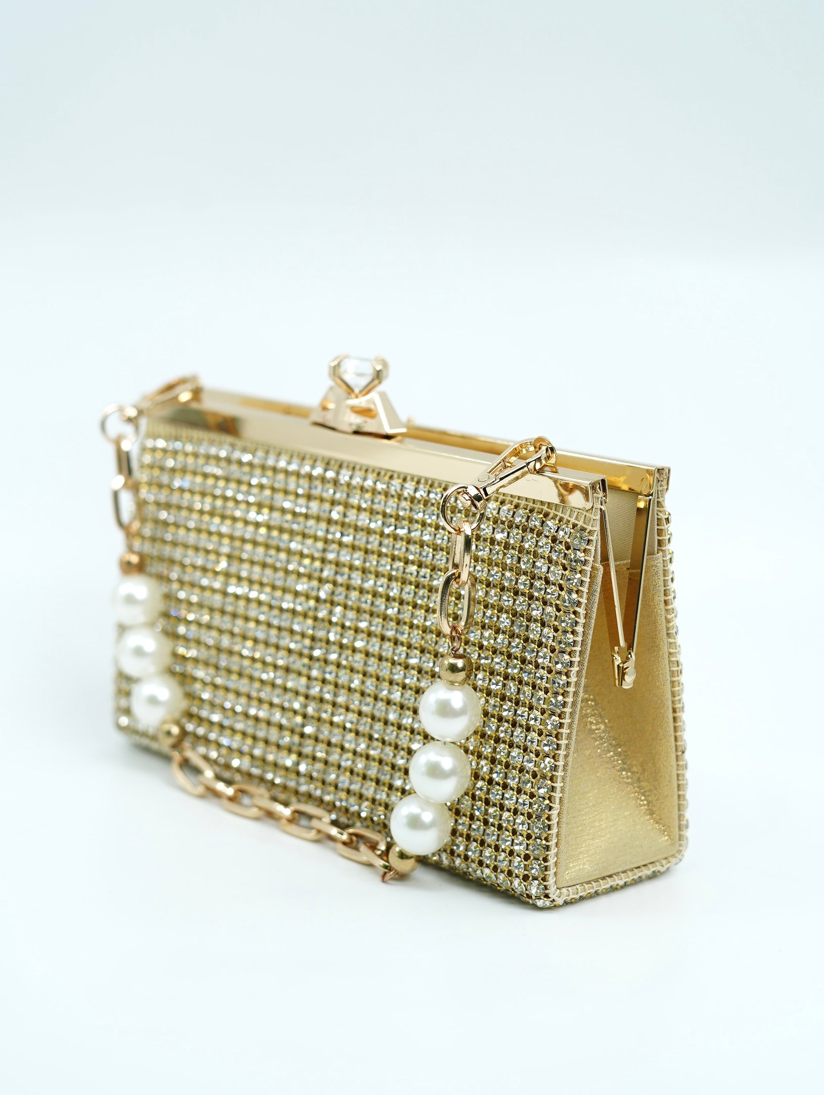 The golden rhinestone clutch